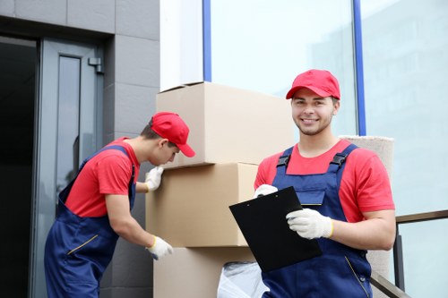 Volunteers loading donated furniture for charity reuse