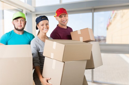 Crew securing furniture with straps during a move