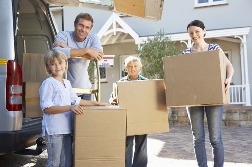 Experienced team packing boxes for relocation