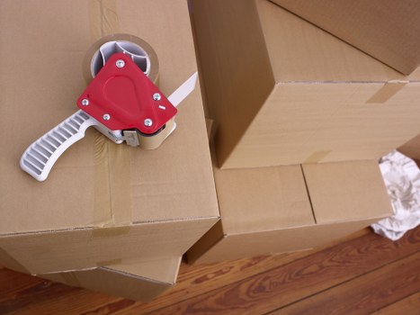 Professional man loading goods into van in Ealing